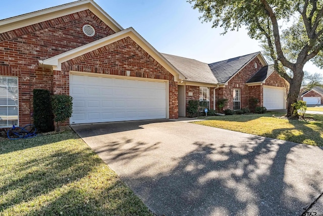 view of front of home featuring a garage and a front yard