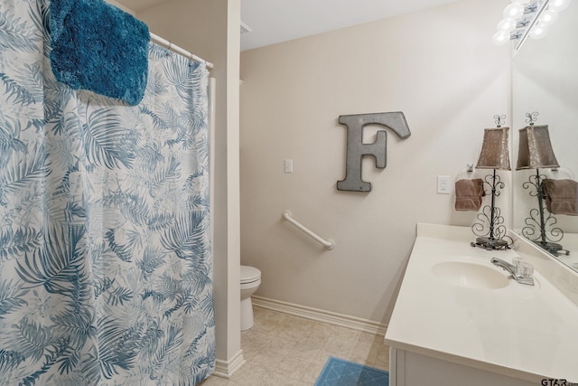 bathroom featuring vanity, toilet, and a shower with shower curtain