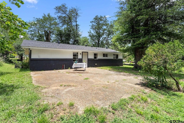 412 W 25th St, Tyler, TX 75702 - rear view of house with brick siding