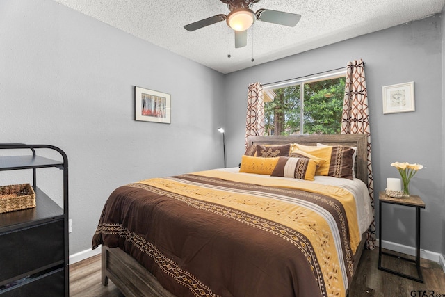 412 W 25th St, Tyler, TX 75702 - bedroom with wood finished floors, a textured ceiling, and ceiling fan