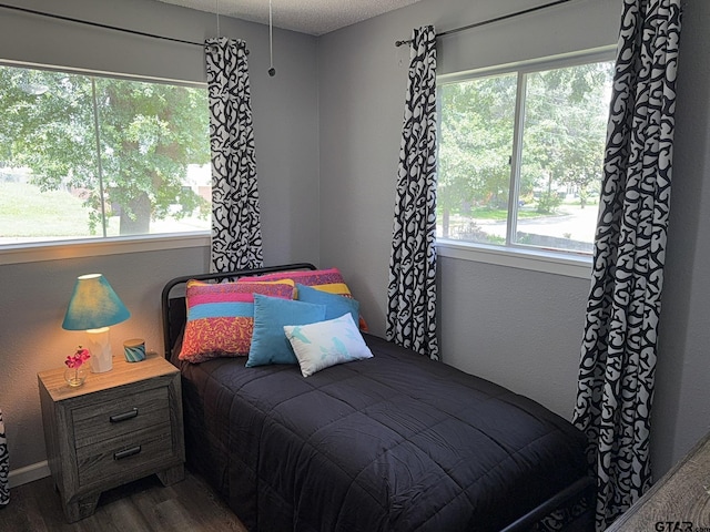 412 W 25th St, Tyler, TX 75702 - bedroom with dark wood finished floors