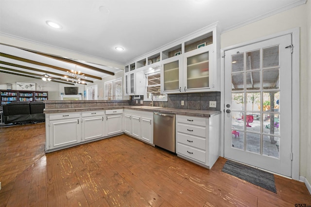 kitchen featuring hardwood / wood-style floors, lofted ceiling with beams, white cabinetry, and stainless steel dishwasher