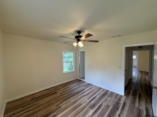320 Northcrest Dr, Tyler, TX 75702 - empty room featuring dark wood-type flooring and a ceiling fan