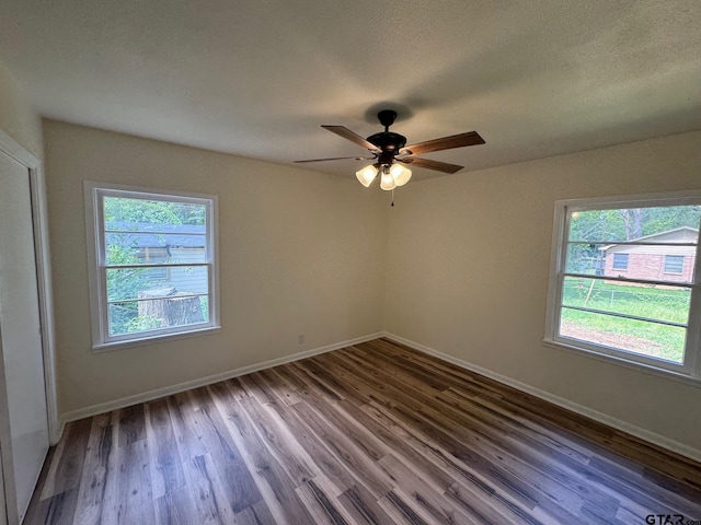320 Northcrest Dr, Tyler, TX 75702 - spare room featuring plenty of natural light, wood finished floors, and a ceiling fan