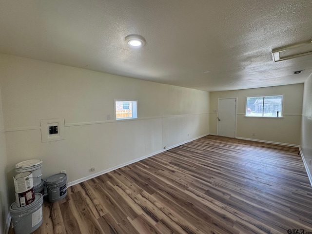 320 Northcrest Dr, Tyler, TX 75702 - unfurnished room with a textured ceiling and wood finished floors