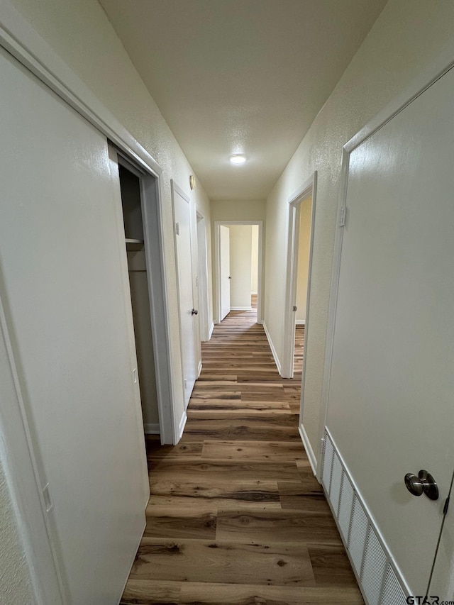 320 Northcrest Dr, Tyler, TX 75702 - hallway with wood finished floors and a textured wall