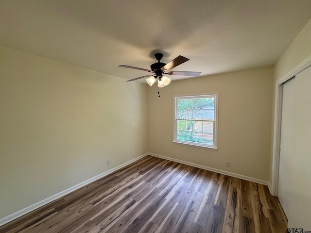 320 Northcrest Dr, Tyler, TX 75702 - unfurnished bedroom featuring wood finished floors, a closet, and ceiling fan