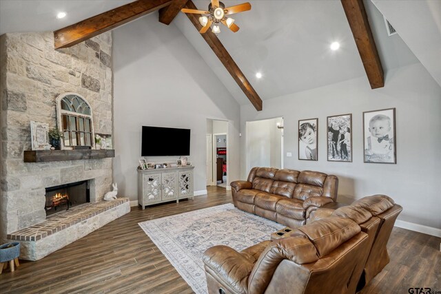 living area with high vaulted ceiling, a ceiling fan, a fireplace, wood finished floors, and baseboards