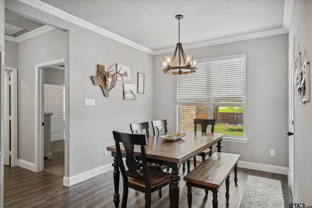 dining space with baseboards, a notable chandelier, crown molding, and dark wood-style flooring