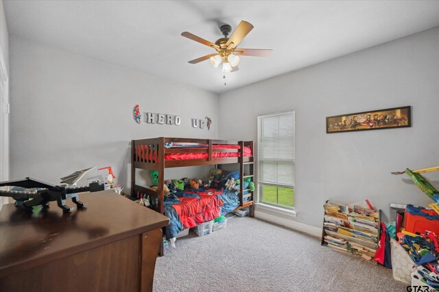 bedroom with baseboards, ceiling fan, and carpet