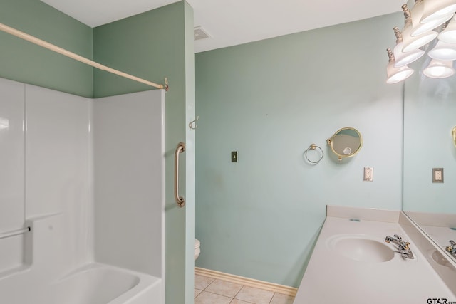 full bathroom with toilet, sink, washtub / shower combination, and tile patterned flooring