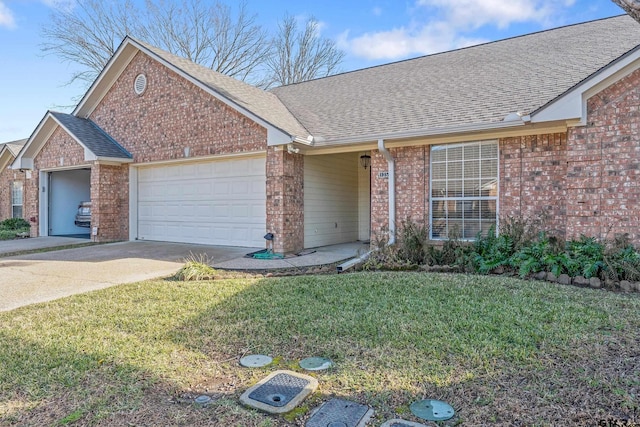 view of front of house with a front lawn and a garage