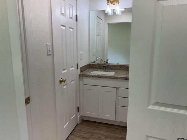 180 Lovers Ln, Alto, TX 75925 - bathroom with vanity and wood finished floors