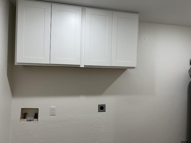 180 Lovers Ln, Alto, TX 75925 - laundry area featuring electric dryer hookup, cabinet space, and hookup for a washing machine