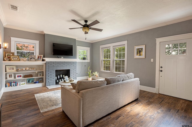 316 Polk St, Gilmer, TX 75644 - living area featuring crown molding, a ceiling fan, visible vents, and wood finished floors