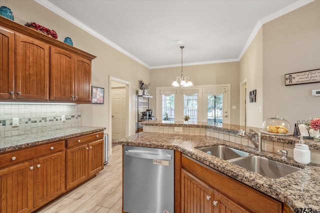 3109 Granbury Ct, Tyler, TX 75707 - kitchen featuring dishwasher, decorative backsplash, a chandelier, brown cabinetry, and crown molding