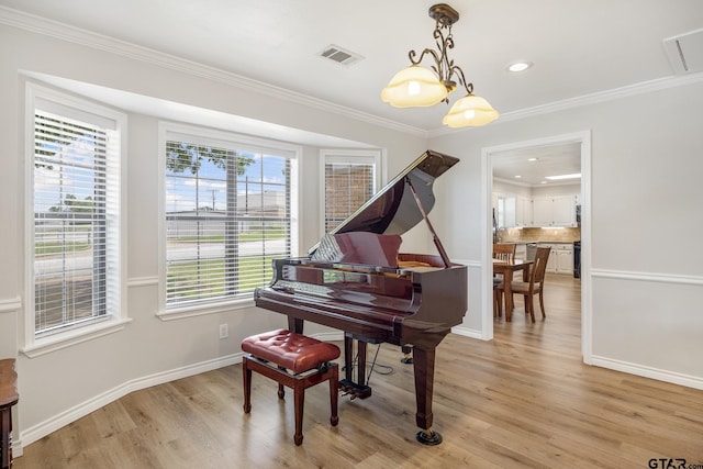104 W Perry St, Frankston, TX 75763 - sitting room featuring light wood-style floors, ornamental molding, and recessed lighting
