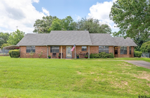 104 W Perry St, Frankston, TX 75763 - view of front facade featuring brick siding, a carport, and roof with shingles