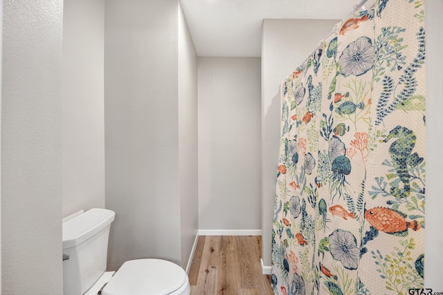 104 W Perry St, Frankston, TX 75763 - bathroom with wood finished floors and curtained shower