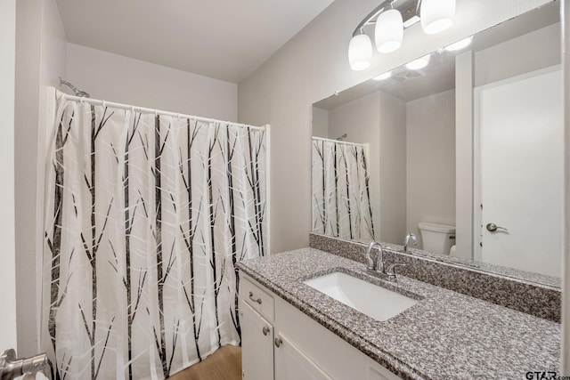 104 W Perry St, Frankston, TX 75763 - bathroom with vanity, wood finished floors, and a shower with curtain