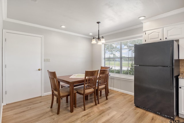 104 W Perry St, Frankston, TX 75763 - dining space with light wood-style floors, ornamental molding, a chandelier, and recessed lighting
