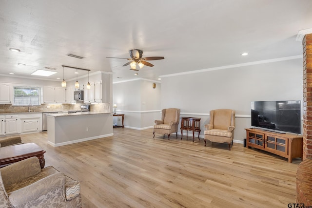 104 W Perry St, Frankston, TX 75763 - living room featuring ceiling fan, light wood-style floors, crown molding, and recessed lighting