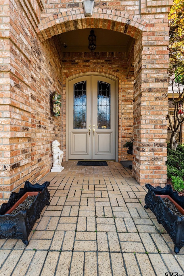 entrance to property featuring french doors