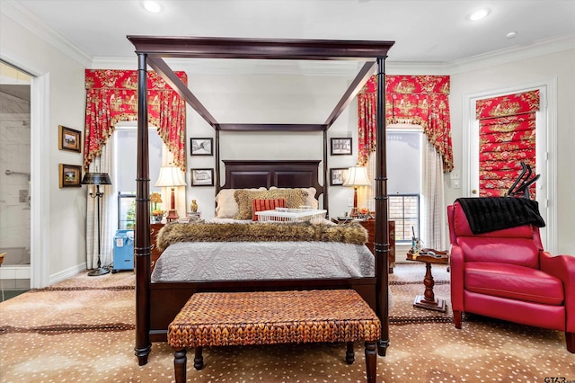 bedroom with ensuite bathroom and crown molding