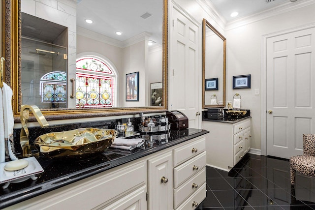 bathroom featuring vanity, tile patterned floors, and ornamental molding