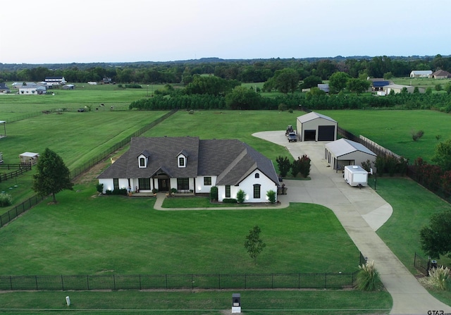 birds eye view of property with a rural view