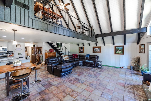 living room featuring a high ceiling