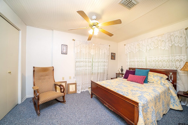 carpeted bedroom featuring a closet and ceiling fan