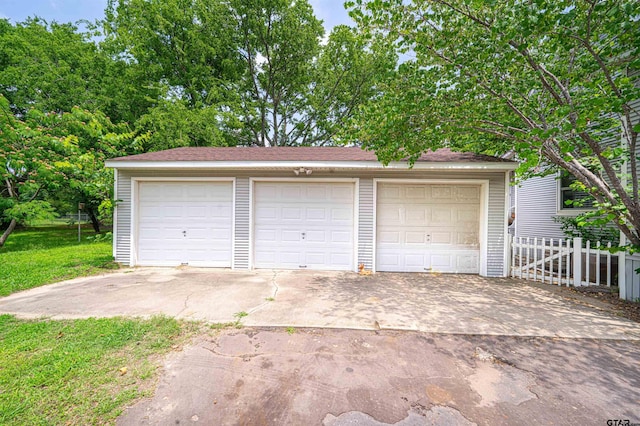 garage with a lawn