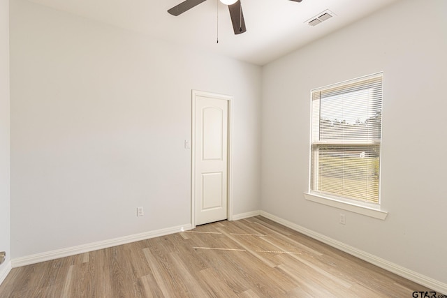 unfurnished room featuring ceiling fan and light hardwood / wood-style floors