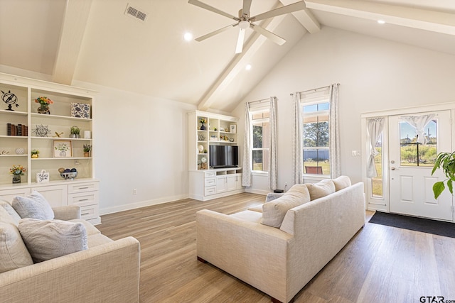 living room with beamed ceiling, ceiling fan, high vaulted ceiling, and light wood-type flooring