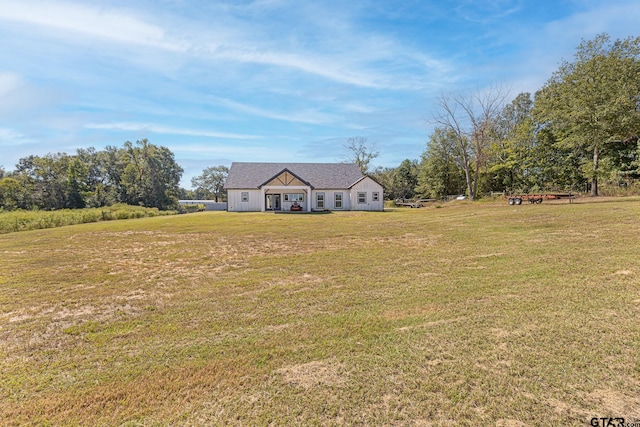 view of front of home with a front yard