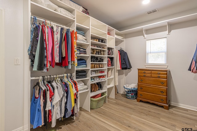 walk in closet featuring hardwood / wood-style floors