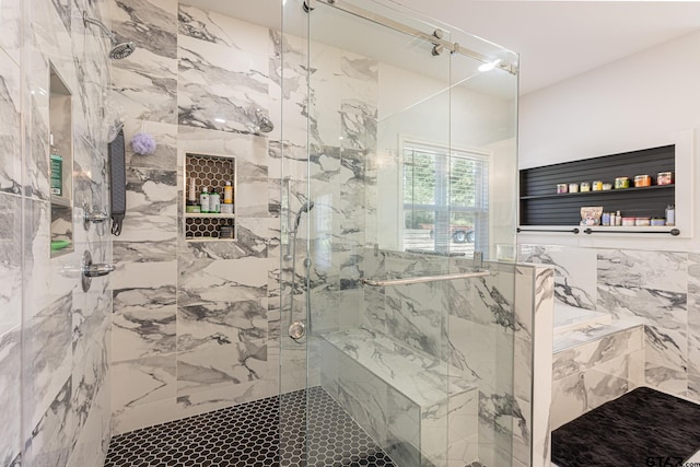 bathroom featuring an enclosed shower