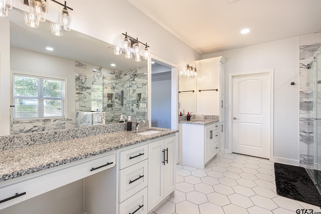 bathroom featuring vanity and a shower with shower door