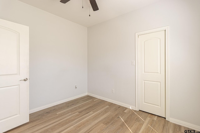 unfurnished room featuring ceiling fan and light hardwood / wood-style flooring