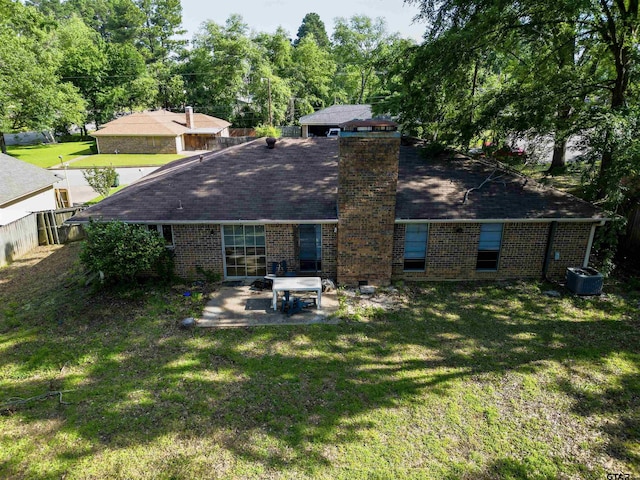 2505 Merry Ln, Tyler, TX 75701 - rear view of property with brick siding, a patio, a chimney, and roof with shingles