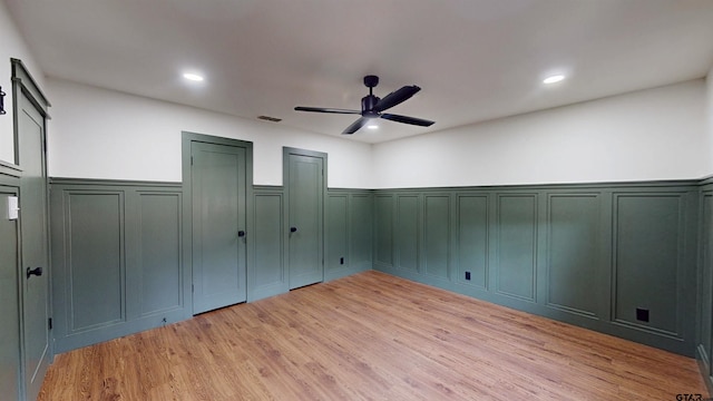 2505 Merry Ln, Tyler, TX 75701 - unfurnished bedroom with a decorative wall, a wainscoted wall, light wood finished floors, recessed lighting, and ceiling fan