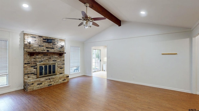2505 Merry Ln, Tyler, TX 75701 - unfurnished living room with a ceiling fan, wood finished floors, plenty of natural light, a fireplace, and recessed lighting