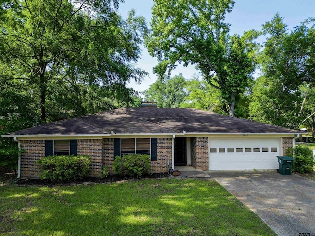 2505 Merry Ln, Tyler, TX 75701 - single story home with driveway, an attached garage, a front yard, brick siding, and a shingled roof