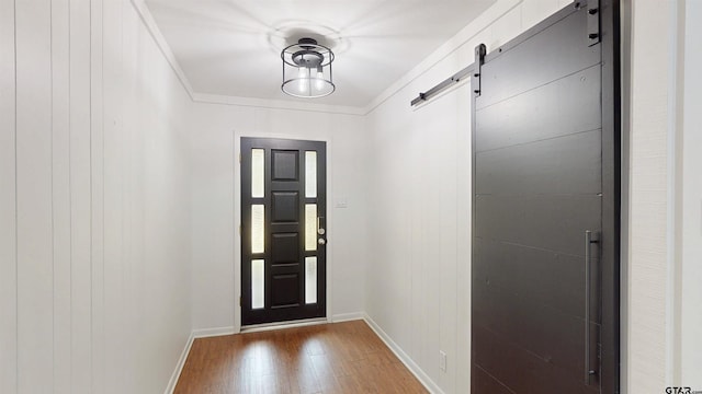 2505 Merry Ln, Tyler, TX 75701 - doorway with light wood-style flooring and a barn door