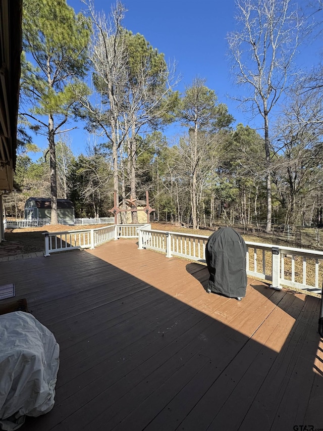 wooden terrace featuring area for grilling