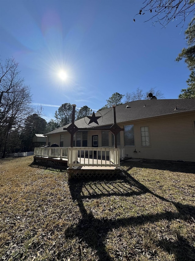 back of property with a wooden deck