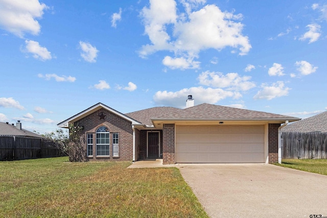 ranch-style house featuring a garage and a front lawn