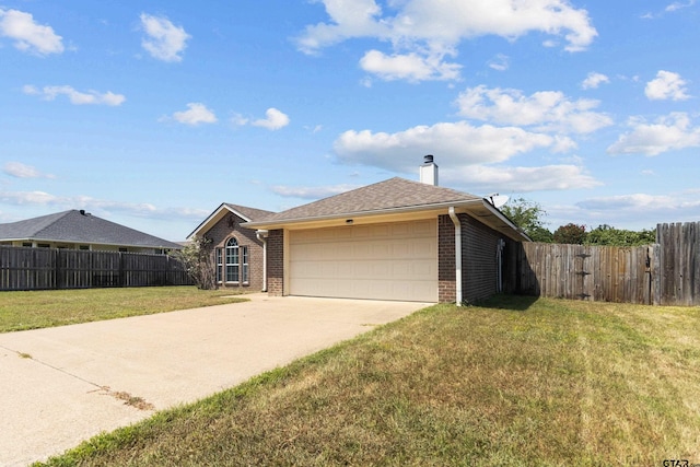 ranch-style home with a garage and a front yard