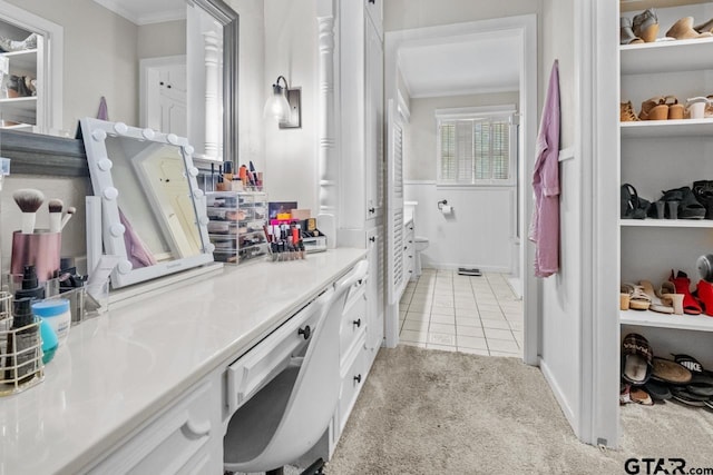 bathroom with tile patterned floors and ornamental molding